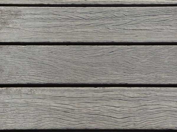 Fresh grey planks with lines set evenly in horizontal fashion.